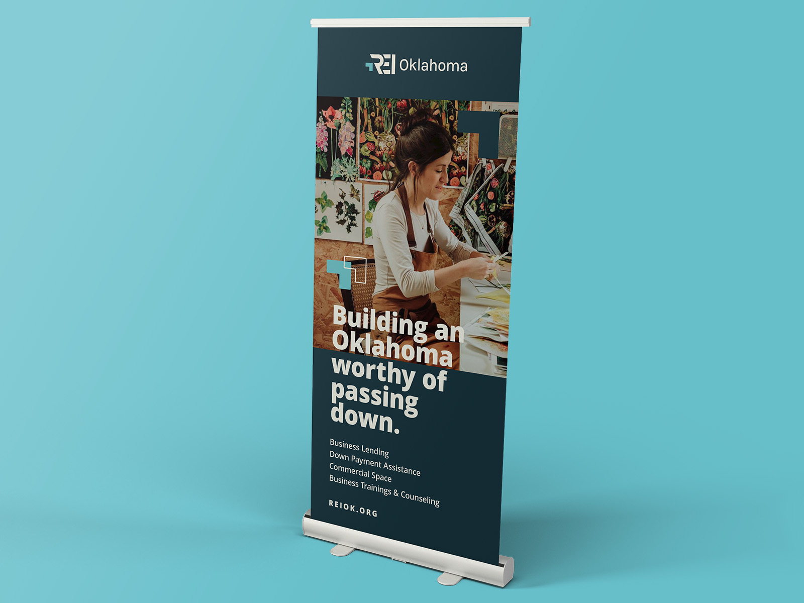 A retractable banner is an example of some of the deliverables created for the REI Oklahoma brand strategy and brand identity. This design features visual identity and verbal identity elements.